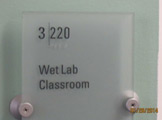 Photo of Locy Hall room number 3-220 label outside the room