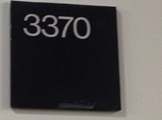 Upclose image of the door sign for Room 3370