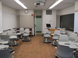 Picture of the room facing the door with chairs on either side of the room