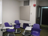 Picture of chairs in the corner of a room 