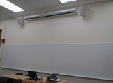 Photo of locy hall room number 106 showing whiteboard