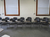 Photo of Locy Hall room number 109 showing chairs in the room