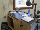 Photo of Locy Hall room number 109 showing teachers' desk