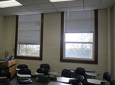 Photo of Locy Hall room number 109 showing two windows in the room