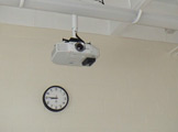 Photo of a projector inside Locy Hall room number 110