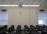 Photo of locy Hall Room Number 214 showing two windows in the room