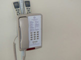 Photo of locy Hall Room Number 301 phone on the wall