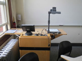 Photo of locy hall room number 303 showing the podium