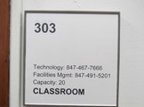 Photo of locy hall room number 303 label outside the room
