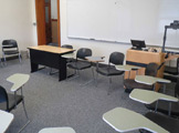 another view of locy hall room number 305 showing chairs and a desk