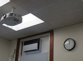 Photo of locy hall room number 305 showing a projector