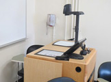 Photo of locy hall room number 305 showing the podium