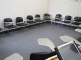 Photo of locy hall room number 314 showing chairs in a corner