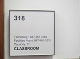Photo of locy hall room number 318 label outside the room