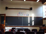 View of blackboards at the front of the classroom.