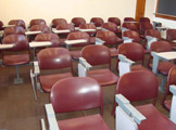 Rows of seats with built-in desks.