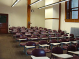 Rows of chairs with built-in desks.