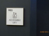 Wheelchair-accessible elevator sign.