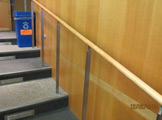 Auditorium staircase and recycling bin.