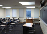 View of classroom seats and podium in front of the room.