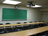 View of blackboard at the front of the classroom.