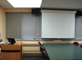 View of projection screen and podium. 