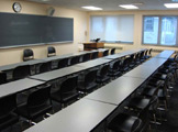 View of podium, blackboard and seating.