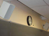 Wall-mounted speakers.