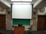 Projection screen and blackboard.
