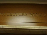lecture room sign above door