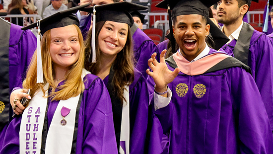 graduates at the arch