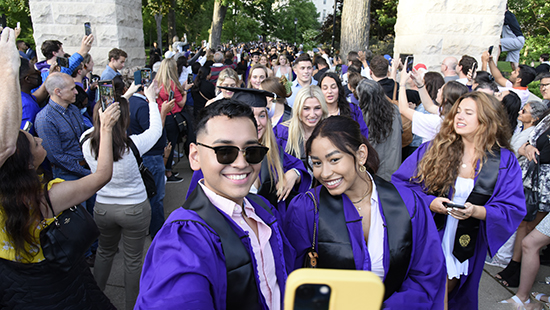 graduates at the arch