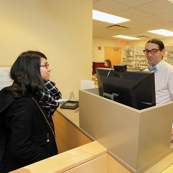 student at the pharmacy counter