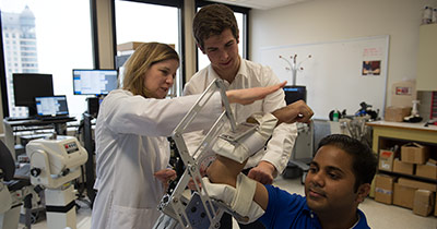 Medical students in a lab with a teacher