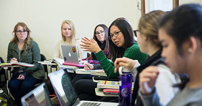 Group of students in a classroom having a discussion 