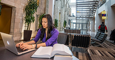 Female student working on a laptop