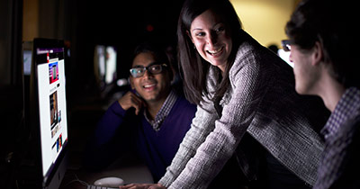 Group of students looking at a computer screen