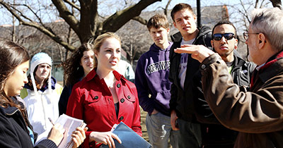 Professor talking to a group of students