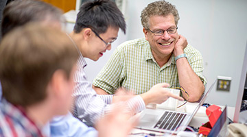 Professor working with students