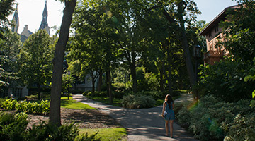 Picture of a student walking through campus