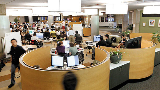 Photo of Students walking around in Library's Information Commons
