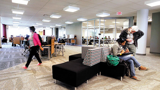 Photo of Students walking through the lobby of the Library