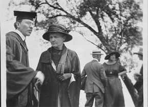 Northwestern University Graduation Ceremony in 1921. From left: Winford Lee Lewis (Chemistry Professor), Marie Curie, and Marie's daughters (in the background). Professor Lewis, at the ceremony, presented Curie with her Northwestern honorary degree. 