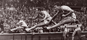 William Porter, center, won a gold medal in the 110-meter hurdles at the 1948 Olympic Games in London. Led by Porter’s Olympic record time of 13.9 seconds, the Americans swept the medals in the event. Porter was inducted into Northwestern’s Athletic Hall of Fame in 1984 as a charter member. 
