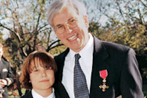 Linn Hobbs with his son, Franklin, on the day Hobbs was named Honorary Officer of the Order of the British Empire