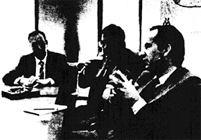 Group of men around a table
