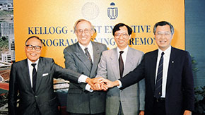 People posing during a signing ceremony