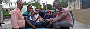 People in the back of a truck in the Dominican Republic