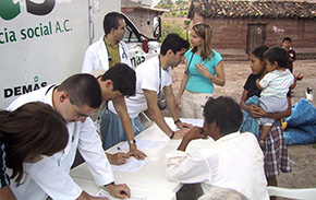 A photo of a student from NU and a Mexico boy