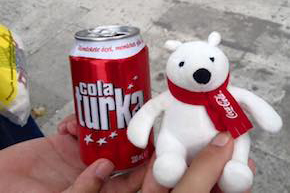 A student holding a Turkish Coca-cola can